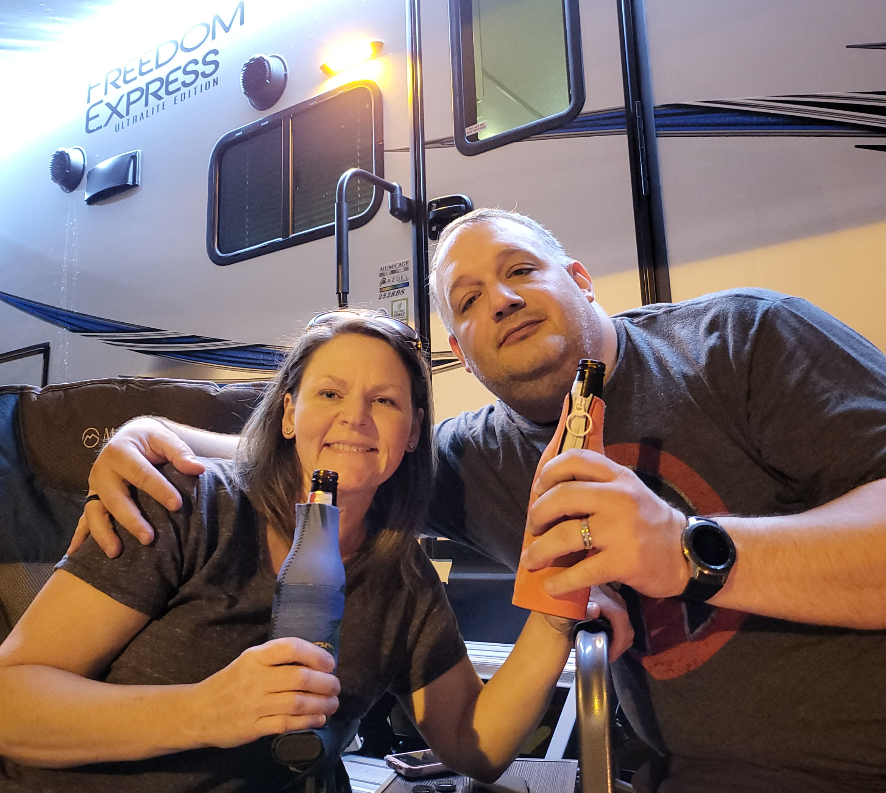 Dede and Aaron in front of the camper